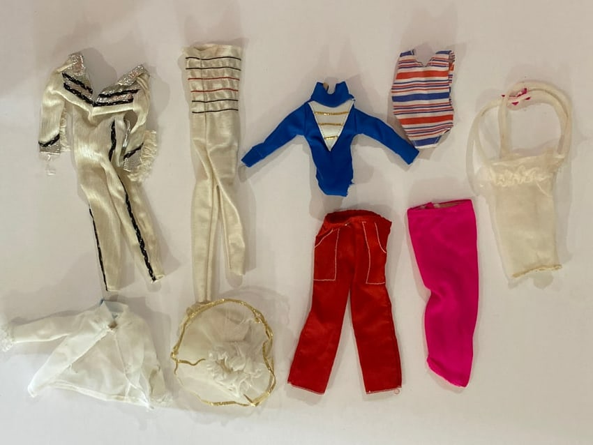Vintage Barbie Doll Clothing Dress, Pants & Shirt Lot: This lot includes a group of vintage Barbie doll skirts, shirts and pants designed for Mattel Barbie fashion dolls. Clothing pieces such as these were produced in a variety of fabrics and styles