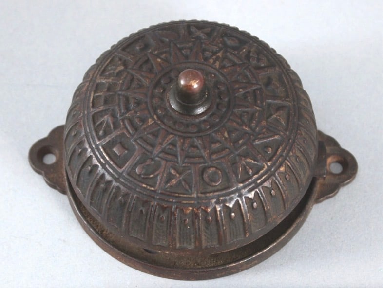 19th Century East Lake Hardware Cast Iron Door Bell: 19th century Eastlake-style cast iron doorbell. Eastlake design, associated with late 19th century decorative arts and architecture, is known for angular ornament and incised surface detail that also
