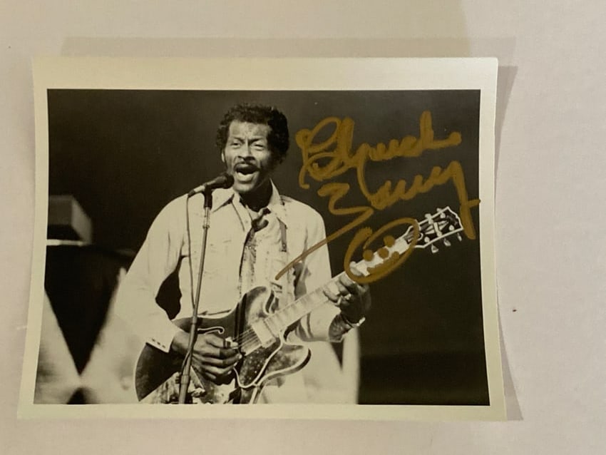 Chuck Berry Autographed Photo: Autographed photo of Chuck Berry, one of the foundational figures of rock and roll and the writer-performer behind songs such as Johnny B. Goode, Roll Over Beethoven, and Maybellene. Signed