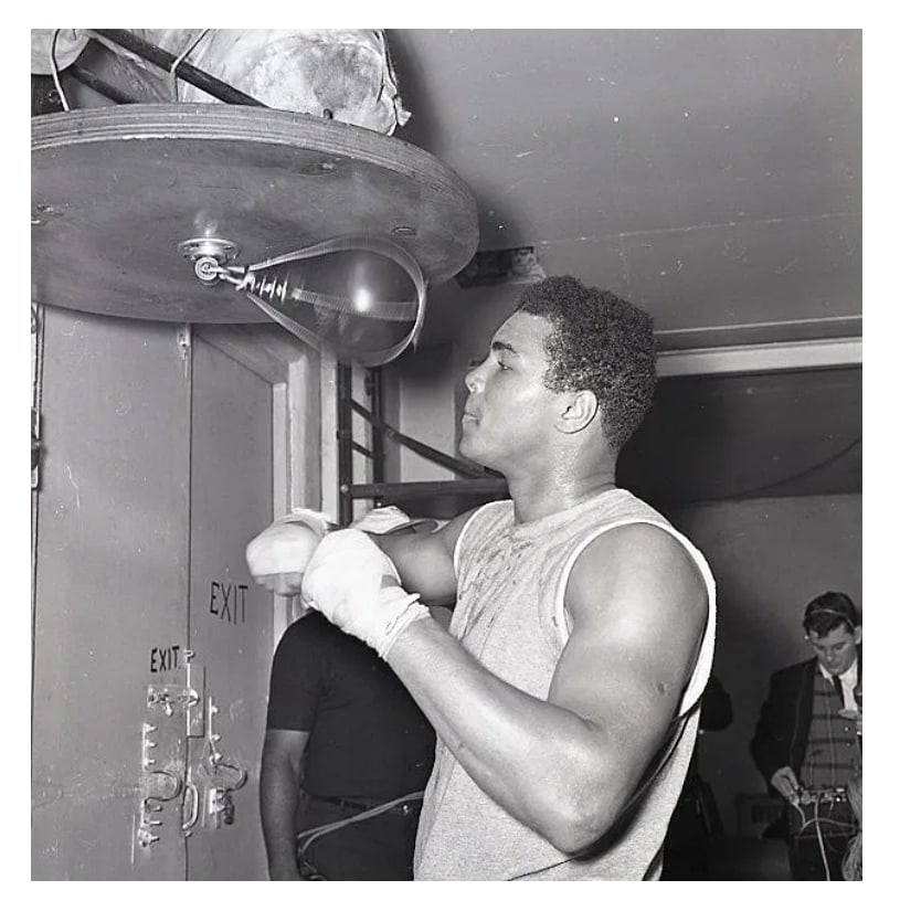 Original Muhammad Ali Howard Bingham Photo Negative: Original one of a kind vintage photographic negative by renowned boxing photographer Howard Bingham capturing heavyweight champion Muhammad Ali during an intense training session on the speed bag.