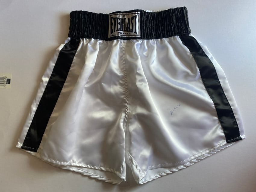 Muhammad Ali Autographed Boxing Shorts PSA COA: Exceptional pair of vintage boxing trunks personally signed by legendary heavyweight champion Muhammad Ali. These authentic fight-style boxing shorts feature a bold autograph from Ali and are accompan