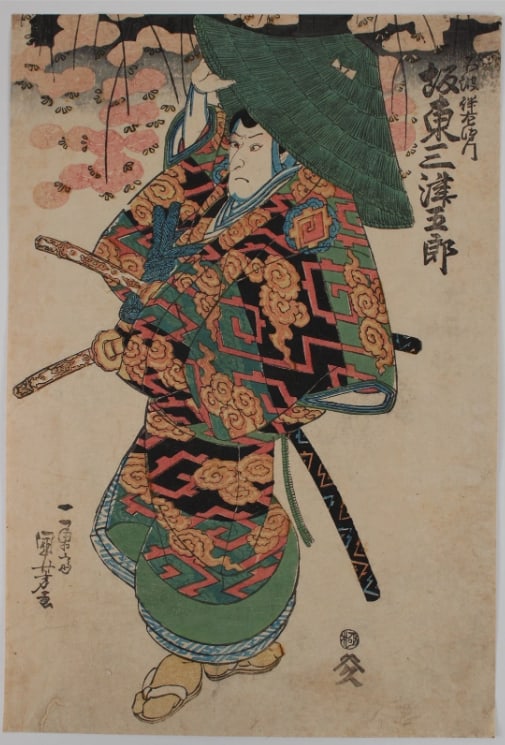 19th Century Utagawa Kuniyoshi Japanese Woodblock Print: Actor Seki Sanjûrô II as Fuwa Banzaemon, right sheet of a triptych also with Iwai Tojaku I as the geisha’s assistant (Nakai ) Oyama (C), and Nakamura Shikan II as Nagoya Sanza (L).Play: Sakuradoki