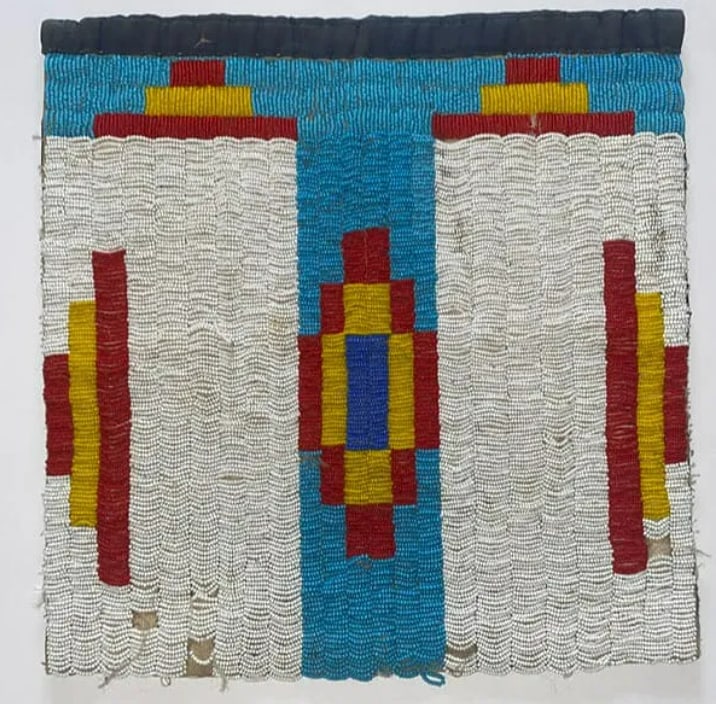 Early 20th Century Ojibwe tribe Beaded Tobacco Bag: A beautiful and well-preserved example of a Native American beaded bag, attributed to the Ojibwe (Chippewa) with strong Northern Plains design influences. This piece is a classic "transitional" era ar