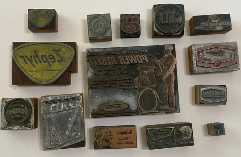 Vintage Car and Gas Company Stationary Printing Blocks: Set of vintage printing blocks used by automotive and gas companies, representing early commercial advertising and print production.