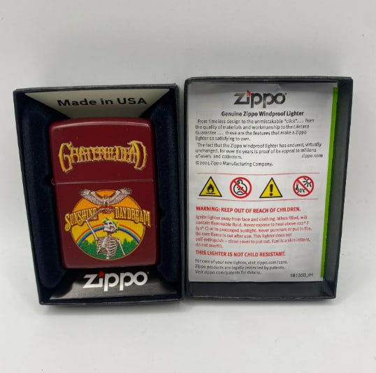Grateful Dead Sunshine Daydream Zippo Lighter: Vintage Zippo lighter featuring Sunshine Daydream design associated with Grateful Dead, collectible for fans of the band.