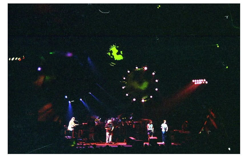 Jerry Garcia Grateful Dead Original Ebet Roberts Photo Negative: This lot features an original photographic negative by Ebet Roberts depicting members of the Grateful Dead performing live on stage at the Knickerbocker Arena in Albany, New York in 1995. The image pr