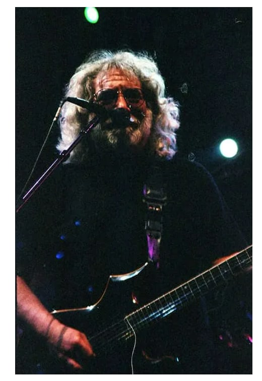 Jerry Garcia Grateful Dead Ebet Roberts Photo Negative: This lot features an original photographic negative of Jerry Garcia, taken by Ebet Roberts during a live performance with the Grateful Dead in Las Vegas in 1995. The image shows Garcia on stage singin