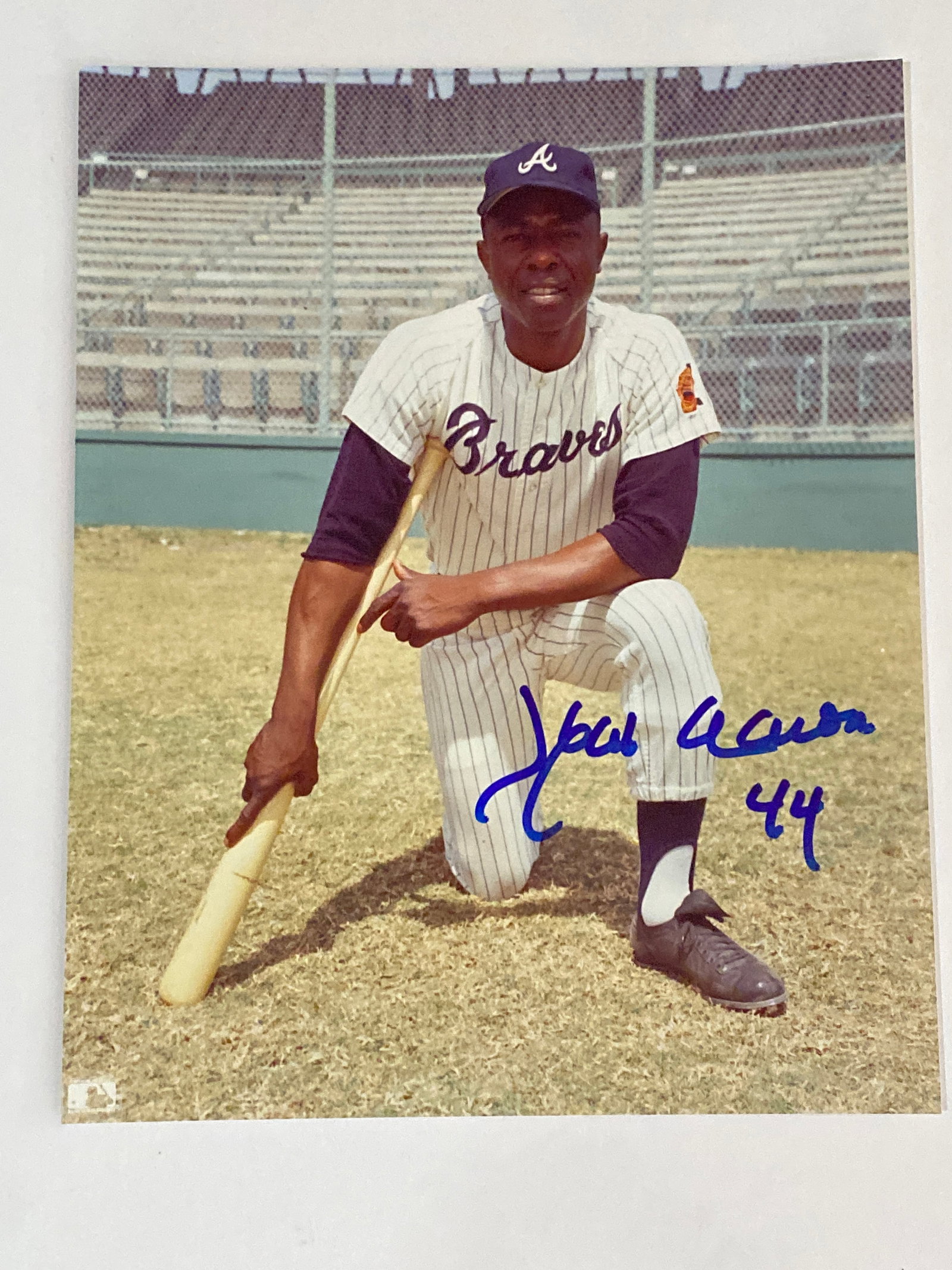 Hank Aaron Autographed Photo PSA: Autographed photograph of Hank Aaron authenticated by PSA. Measures 8x10