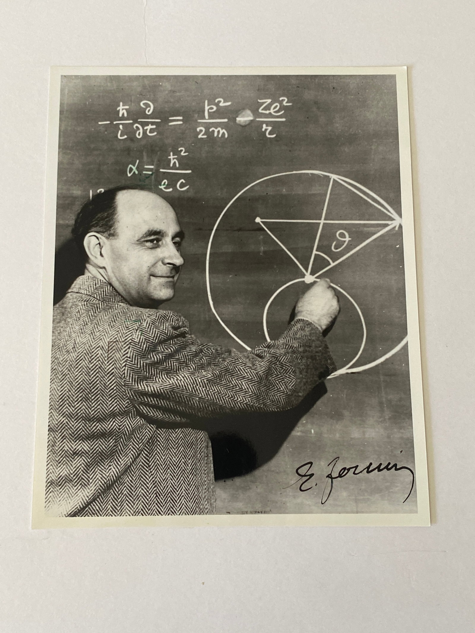 Enrique Fermi Autographed Photo: Autographed photograph of Enrico Fermi, the Nobel Prize-winning scientist whose groundbreaking work helped shape modern nuclear physics and atomic research. Measures8x10