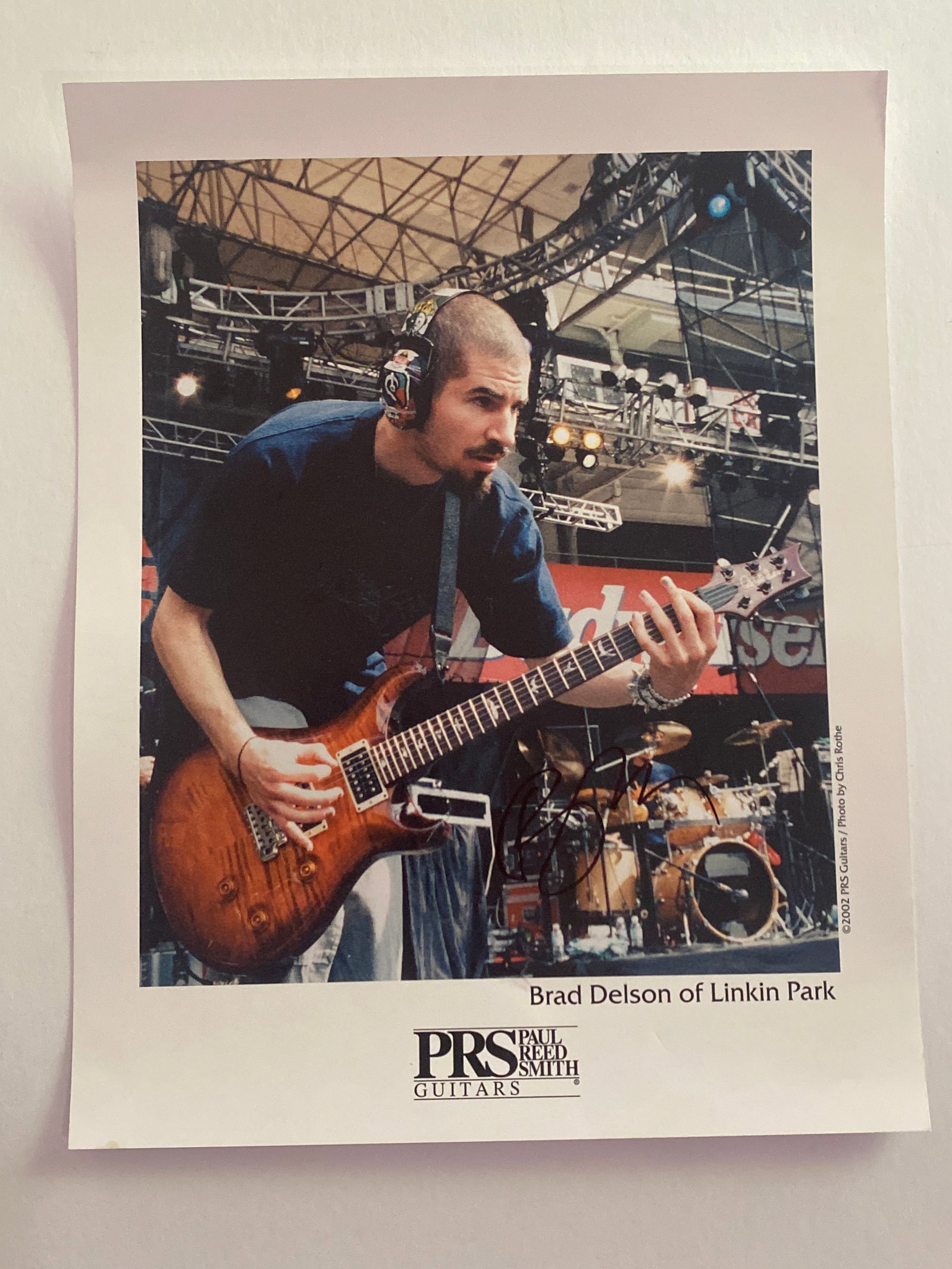 Brad Delson Lincoln Park Signed PRS Poster: PRS promotional poster signed by Brad Delson, offering modern rock memorabilia tied to the influential nu-metal band. Measures 14x11