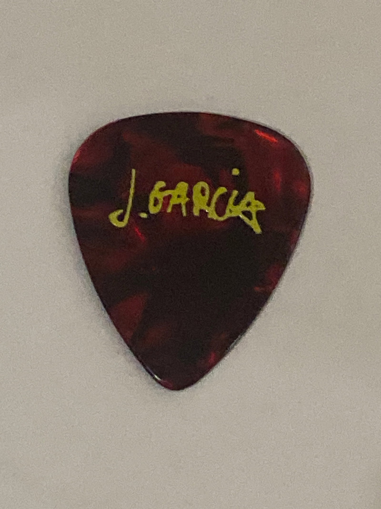 Jerry Garcia Grateful Dead Custom Guitar Pick: Custom guitar pick associated with Jerry Garcia, representing an intimate and highly collectible piece of music memorabilia.