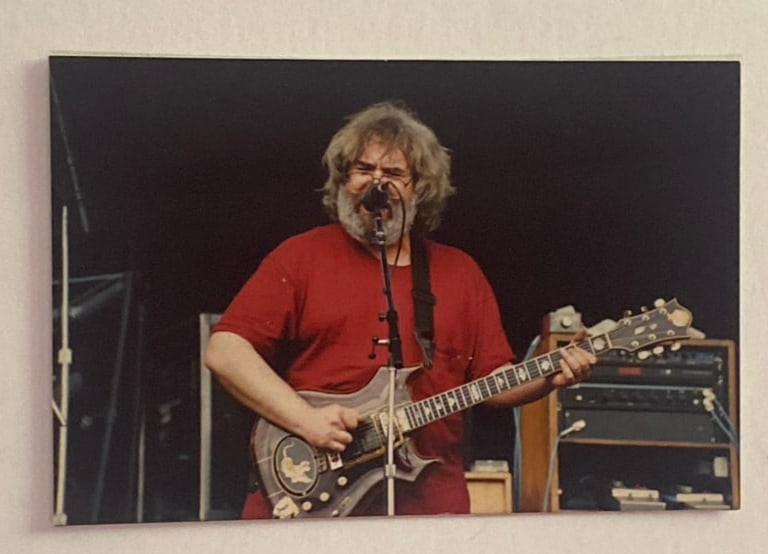 Jerry Garcia Grateful Dead Postcard: Vintage postcard featuring Jerry Garcia and imagery associated with the Grateful Dead, offering nostalgic appeal for collectors of concert and fan memorabilia. 4x6