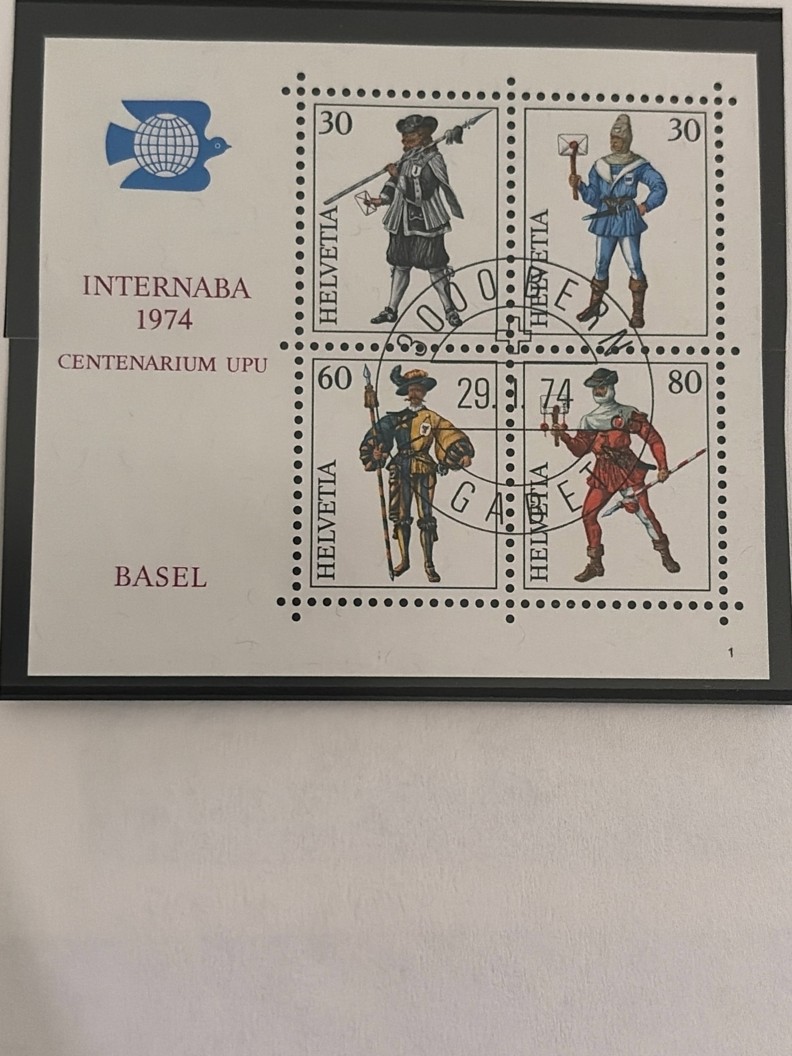 Switzerland 1974 UPU Centenary Basel Souvenir Stamp Sheet: Switzerland 1974 souvenir sheet issued in connection with the Centenary of the Universal Postal Union (UPU) and Basel. Sheet contains four Helvetia stamps depicting historical Swiss figures/costumes i