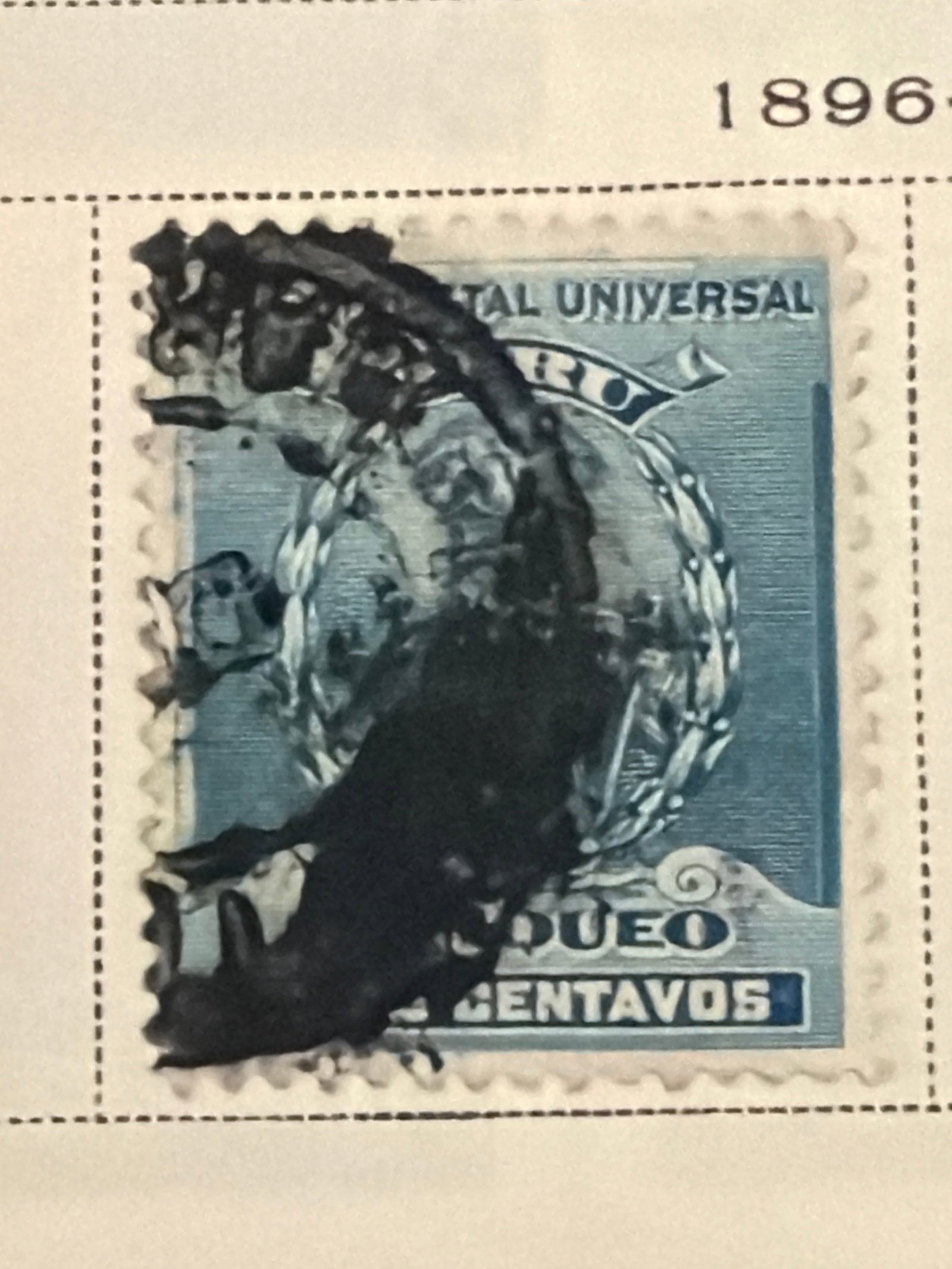 1896 Peru Postal Union Two-Centavos Used Stamp: Single blue Peruvian two-centavos Universal Postal Union issue dating from approximately 1896. The stamp has a very heavy postal cancellation that obscures much of the central design and denomination.