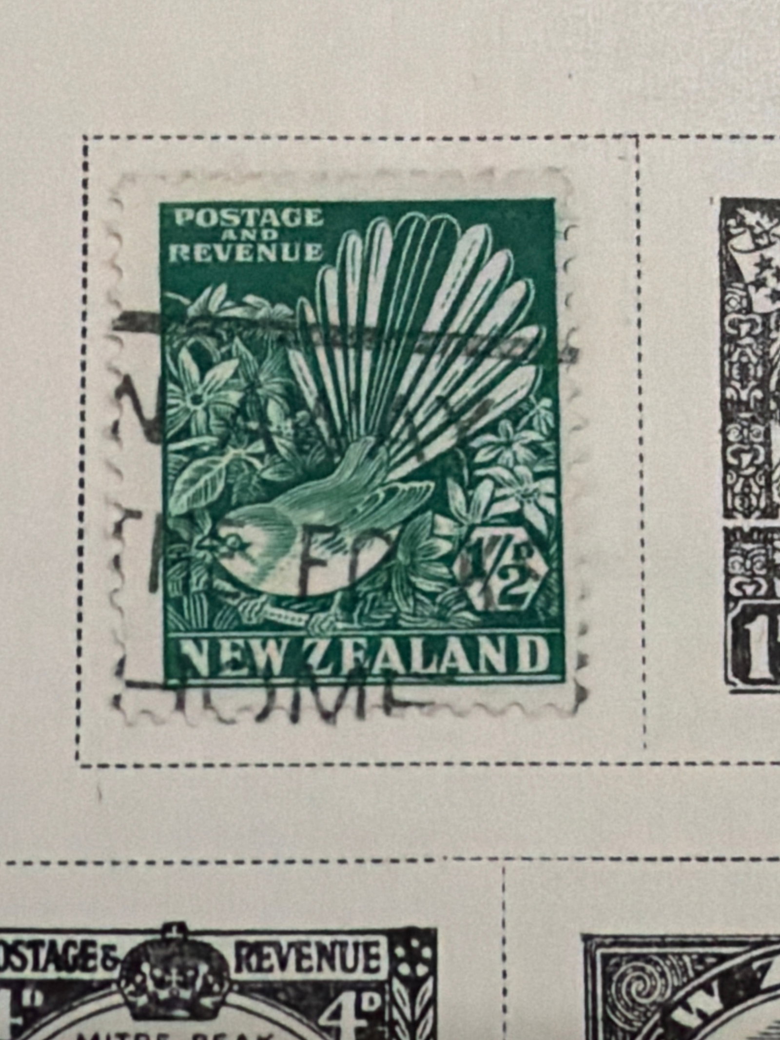 1935-1937 New Zealand Royal and Commemorative Stamp Collection: New Zealand collection featuring royal portraits, commemorative scenes, historical subjects, and architectural designs dating from approximately 1935-1937. Several stamps display visible postal cancel