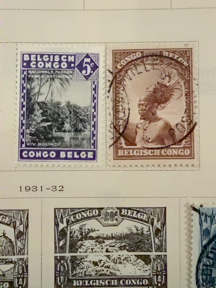 Belgian Congo National Park & Indigenous Portrait Stamp Pair: Pair of vintage Belgian Congo postage stamps. Includes a 5-centime Parc National issue depicting the Molindi River and a brown stamp featuring an Indigenous portrait in ceremonial dress. One stamp bea