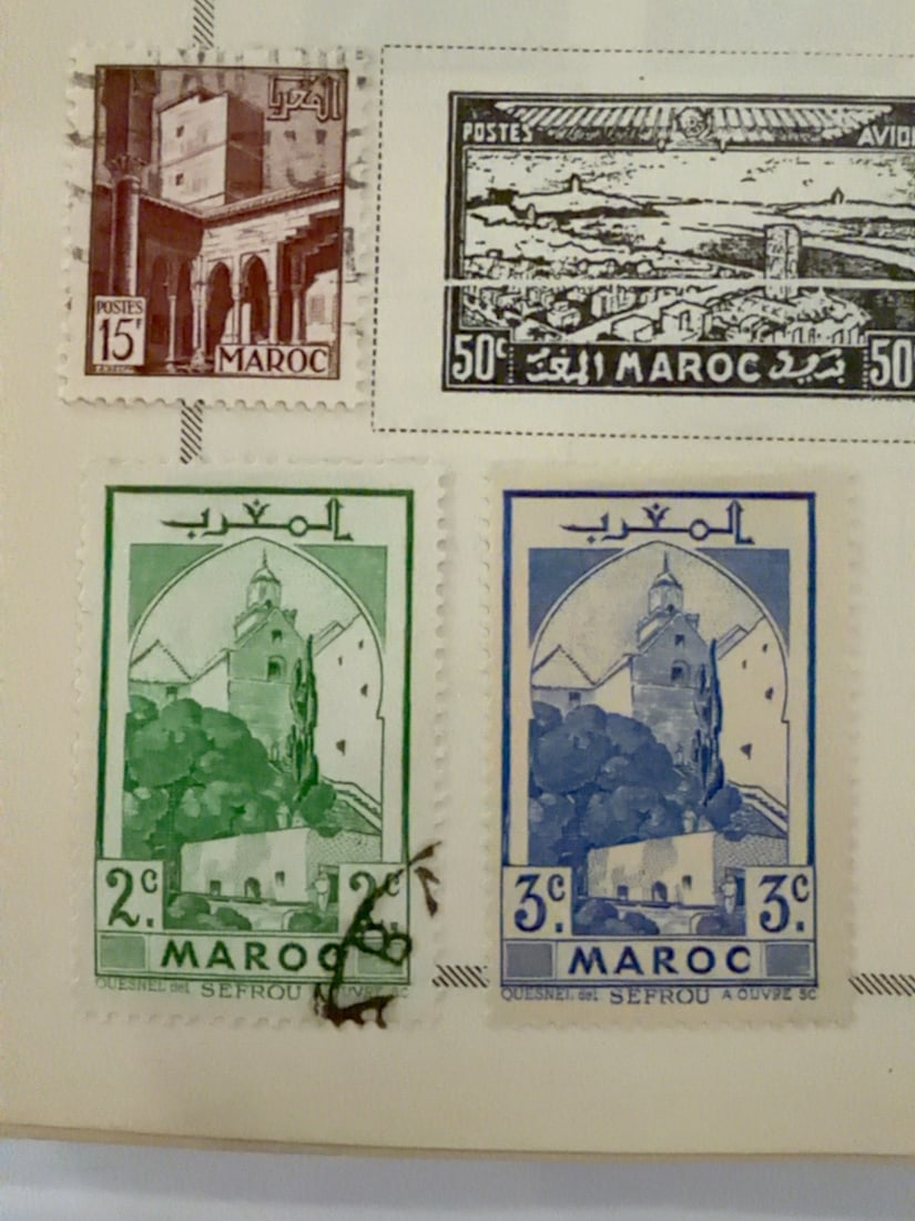 French India France Libre 2 Ca Floral Postage Stamp: Vintage French India 2-ca stamp inscribed France Libre and ?tablissements Fran?ais dans l?Inde, featuring a decorative floral design and Cross of Lorraine. Mounted on an album page with condition as p