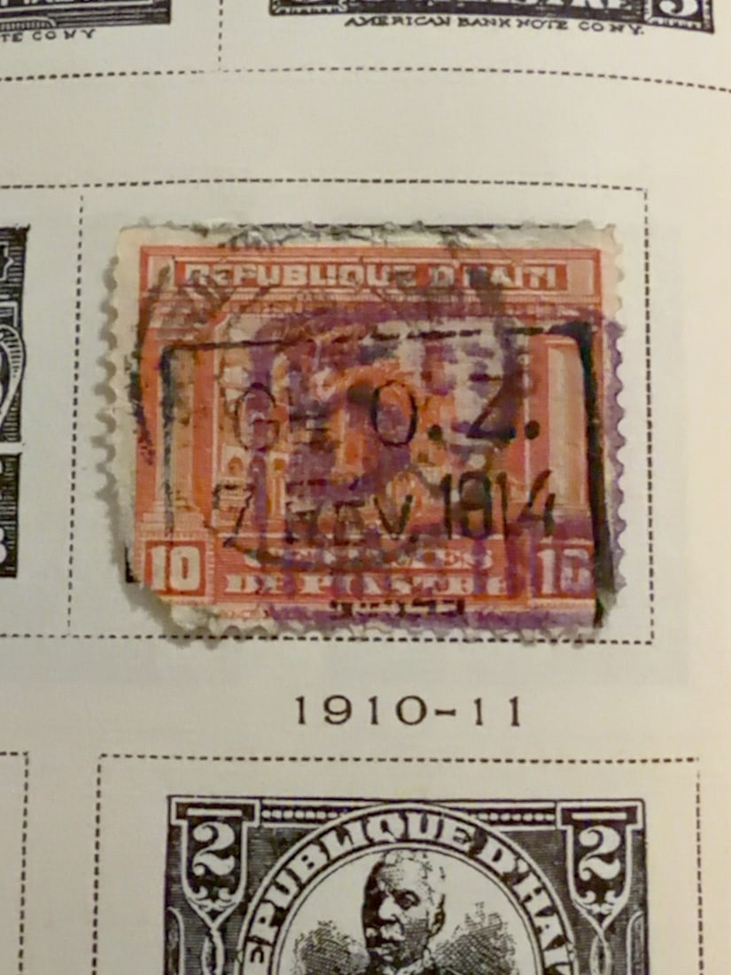 Vintage Haiti 10-Centime Postage Stamp: Early Republic of Haiti 10-centime postage stamp featuring an architectural design. Used condition with prominent postal cancellation, visible wear and age-related toning. Presented on its original al