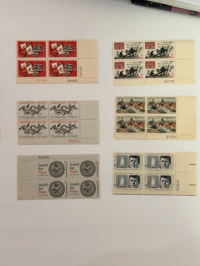 U.S. 1960s Historical Music Peace & Kennedy Plate Blocks: Group of six U.S. four-stamp plate blocks featuring historical battles, wilderness commemoration, American music, Search for Peace and President John F. Kennedy memorial subjects. Blocks retain attach