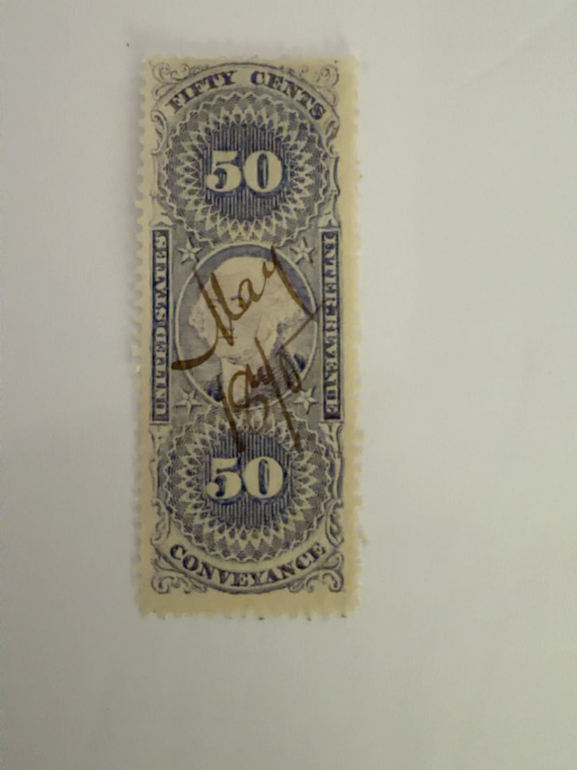 U.S. First Issue Revenue 50-Cent Conveyance Stamp: Antique United States first-issue Internal Revenue 50-cent Conveyance stamp featuring George Washington. Used example with handwritten manuscript cancellation. Visible toning and age-related wear;