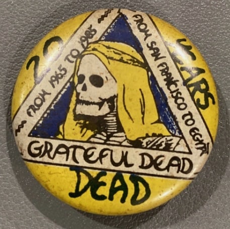 Grateful Dead From Pigs to Bears San Francisco Pinback Button: Grateful Dead pinback button featuring a hooded skeleton illustration and handwritten-style 'From Pigs to Bears / From San Francisco to Egypt' lettering. Visible age and wear as photographed.
