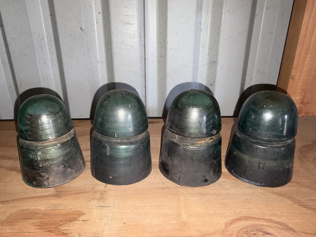Antique Green Glass Utility Insulators (4): Sold as shown.