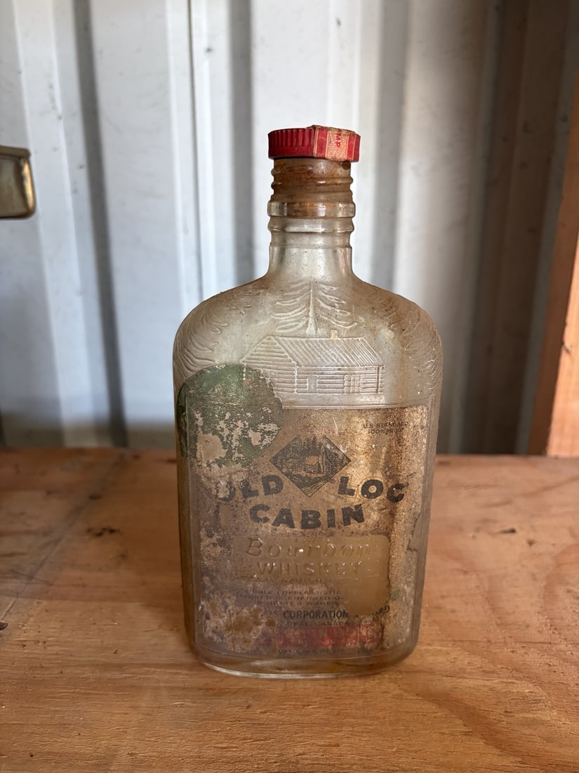 Vintage Old Log Cabin Bourbon Whiskey Embossed Glass Bottle: sold as shown.