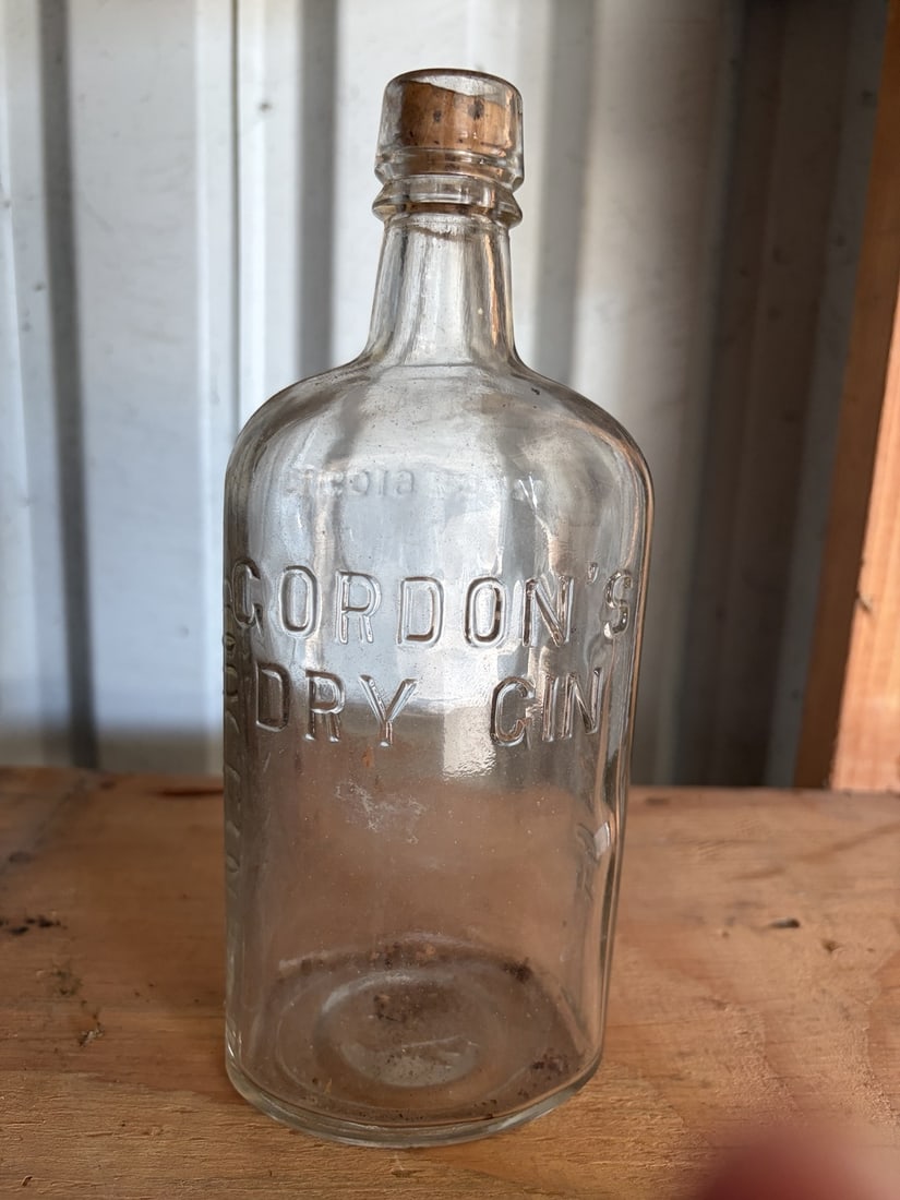 Antique Gordon's Dry Gin Embossed Glass Bottle: sold as shown.