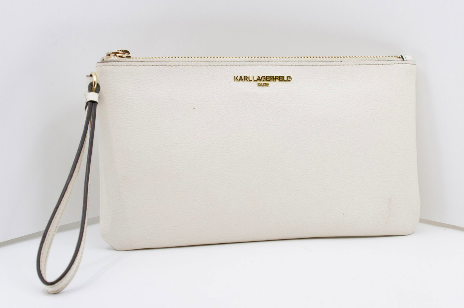Karl Lagerfeld Creme Clutch: Karl Lagerfeld Creme Clutch Width 10" ; Height 5.5" ; Depth 1" ; Strap 7"