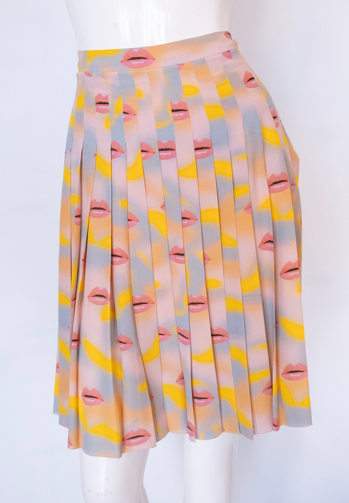 PRADA Silk Pleated Lip Skirt, 2016: PRADA Silk Pleated Lip Skirt, 2016Prada Pastel Lip Print Pleated SkirtSilkHigh waistLong pleatsConcealed zip/hook closureSize EU 44 ; Waist 32" ; Length 23" ; Hem Opening 42" Women's Fashion and Desig