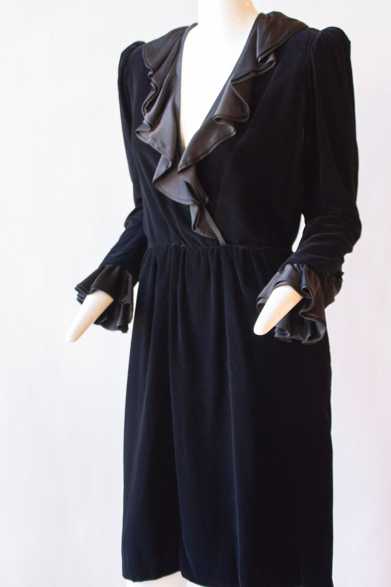 SAINT LAURENT RIVE GAUCHE Black Velvet "Cathrine Deneuve" Dress With Silk Ruffle Neck: SAINT LAURENT RIVE GAUCHE Black Velvet "Cathrine Deneuve" Dress With Silk Ruffle Neck Saint Laurent rive gauche velour black, silk ruffle v-neck, long-sleeve dress The iconic Saint Laurent Rive Gauche