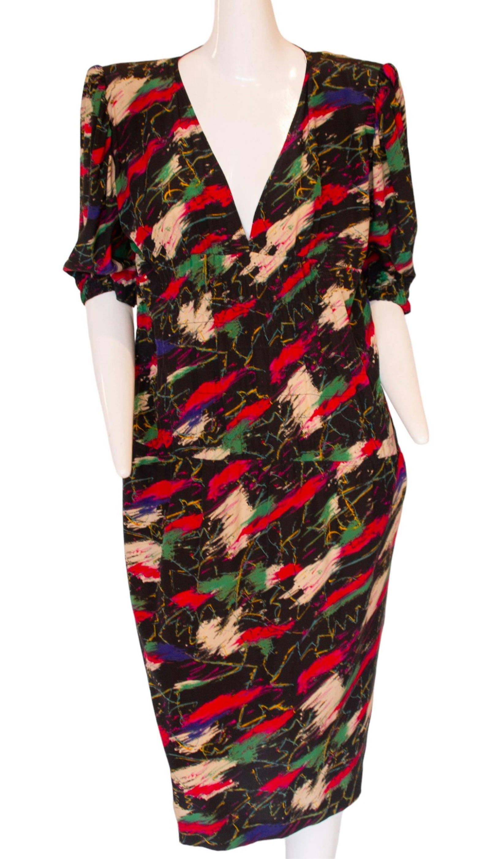 UNGARO Solo Donna Multi-Colored Silk V-Neck Dress, Made in Italy This Ungaro silk dress is the: UNGARO Solo Donna Multi-Colored Silk V-Neck Dress, Made in Italy This Ungaro silk dress is the perfect addition to your wardrobe. The multi-colored silk fabric is light and luxurious, and the v-neck a