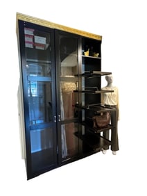 Double glass door wardrobe with retractable shelves and gold crowning.