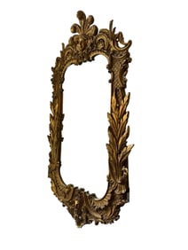 Vintage regency wall mirror, gilt plumed monarch carved from wood. Made in Italy.