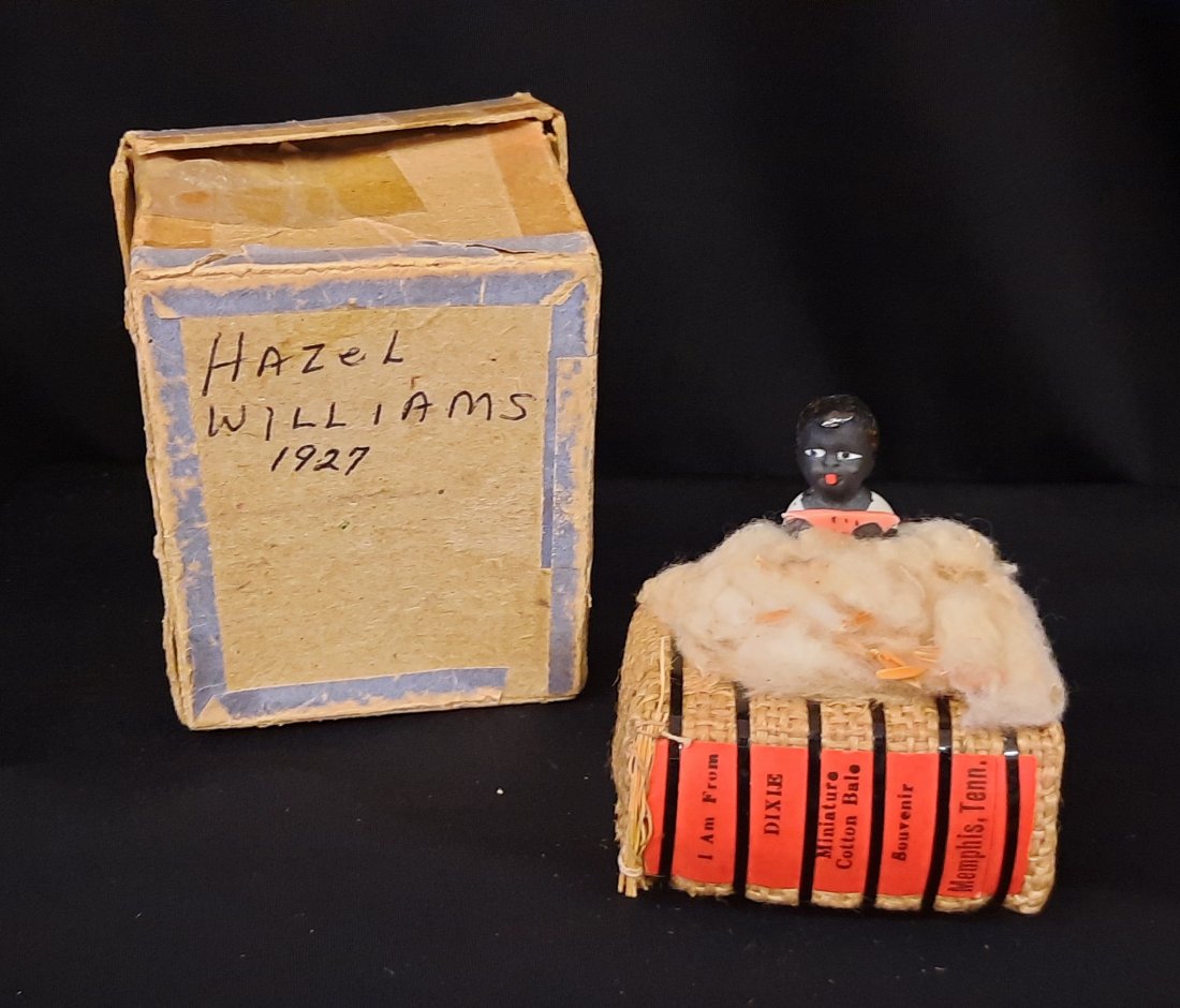 1927 Black Americana Dixie Memphis Tennessee Baby on Cotton Bail: This piece is from Memphis Tennessee. This is a cotton bail with a ceramic bisque baby eating watermelon. These were mini cotton bail souvenirs used as advertising. The bail reads on the side I am fro