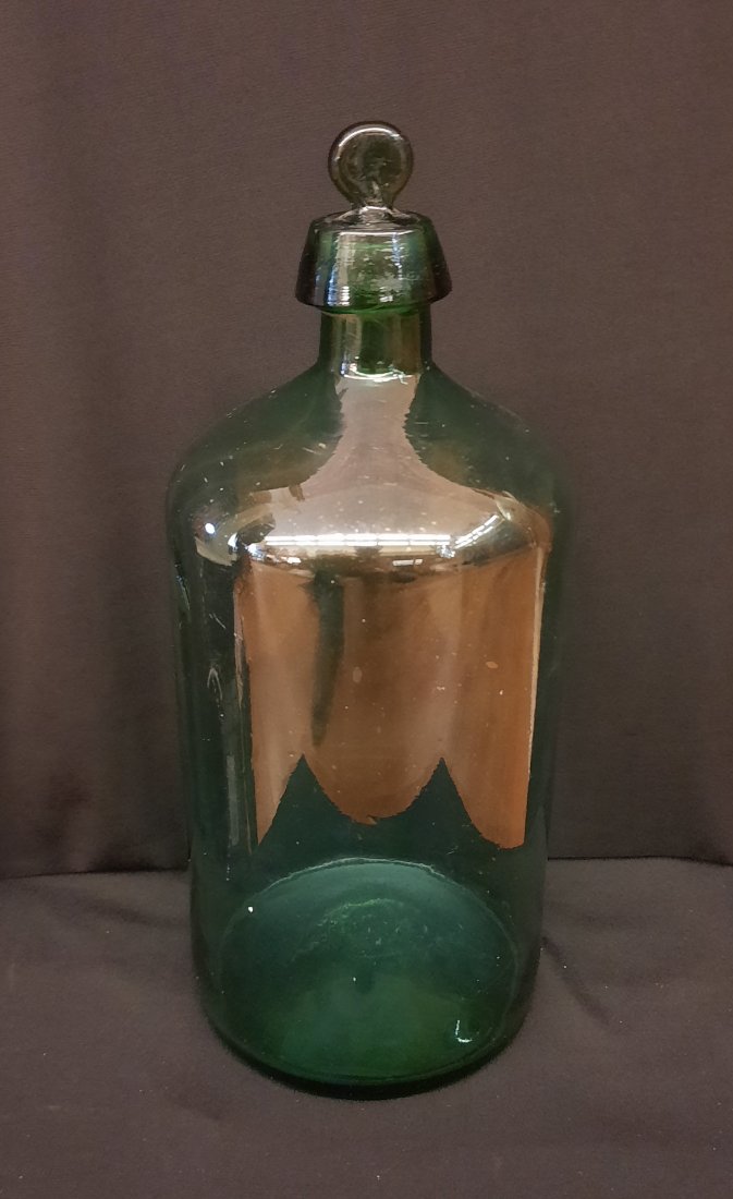 1850’s to Civil War pharmaceutical Bottle With Stopper Open pontil: 1850’s to Civil War pharmaceutical Bottle With matching stopper. The bottle has some bubbles and a beautiful color along with a nice open pontil.
