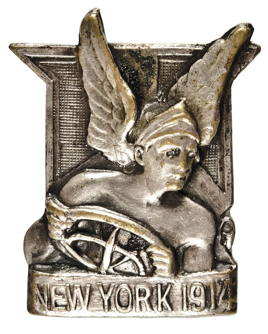 Automobile Race Participant Badge - 1914: Badge, 3/4” x 1,”, silvered brass, gorgeous art-deco, “New York 1914”, with Mercury and his winged helmet, behind the steering wheel. It was made by the New Jersey Company, Whitehead and Hoag