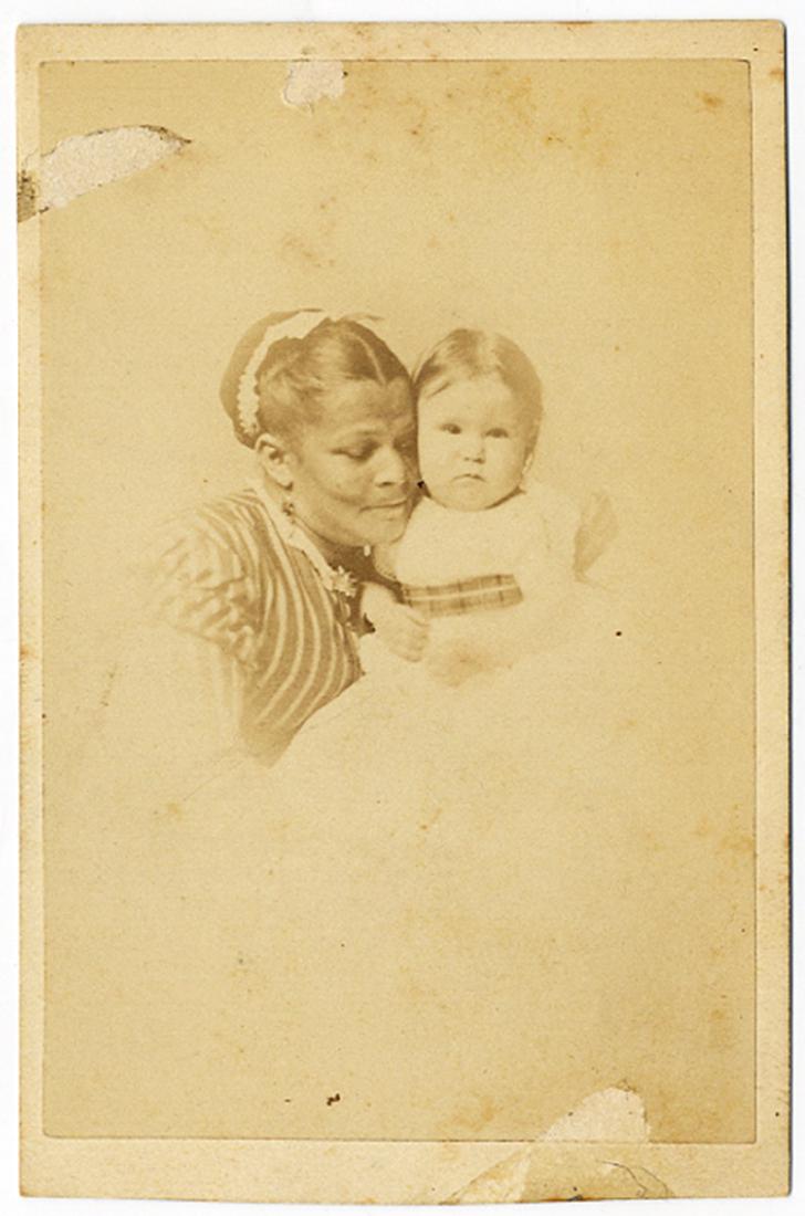 Black Nanny With A White Baby: A vignetted CDV of a a white baby and her black nurse. Loving image as the two are check to check. Ink identification on the reverse, “Racheal Coffin & Priscilla her nurse.” The image is backmarke