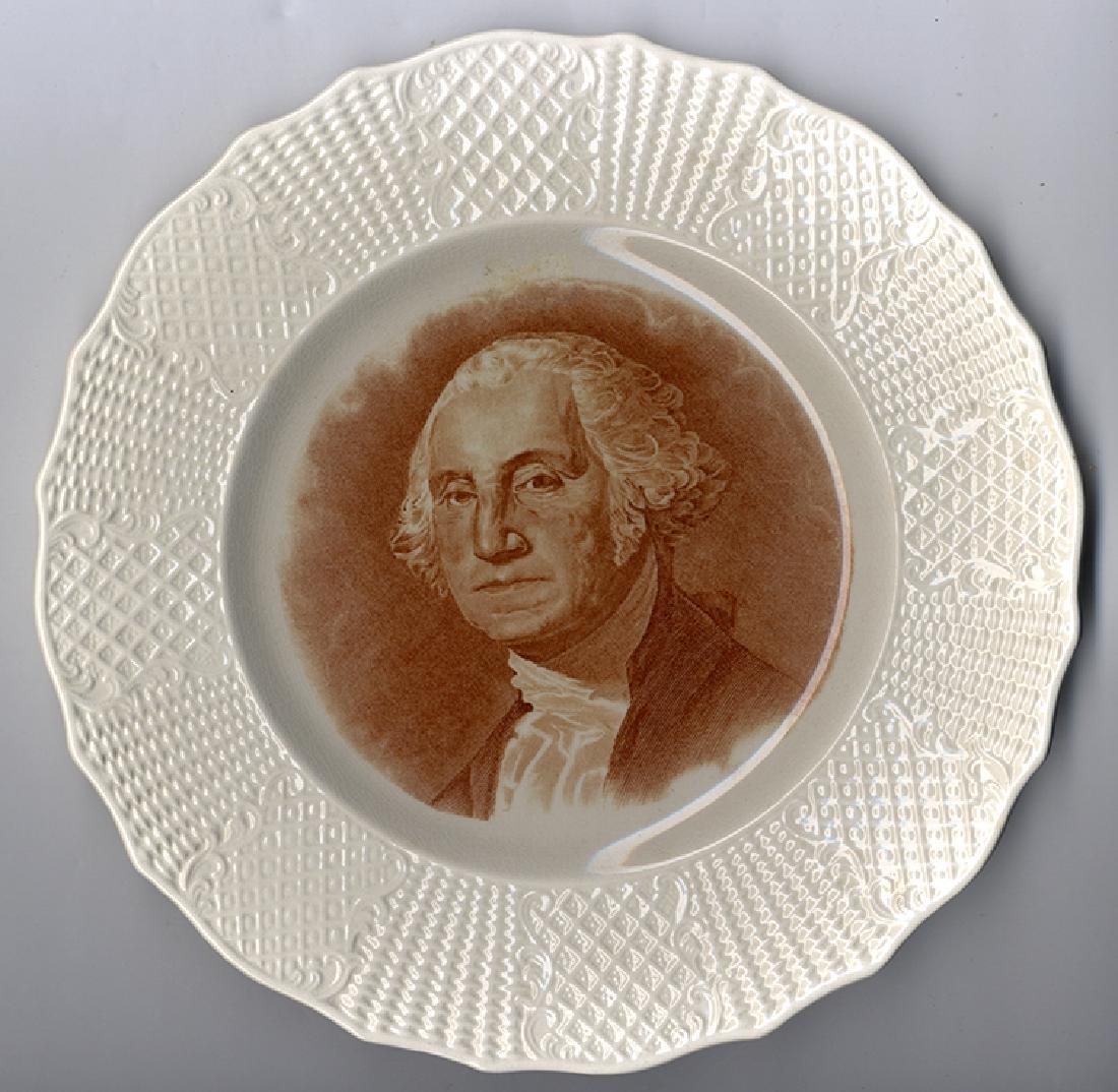 George Washington Bi-Centennial Plate - 1932: This 9” plate has a sepia tone transfer image of Gilbert Stuart’s painting of Washington, scalloped edges, and waffled margins. The maker is ID’d as Fondeville - England, Potted by Soho Pottery