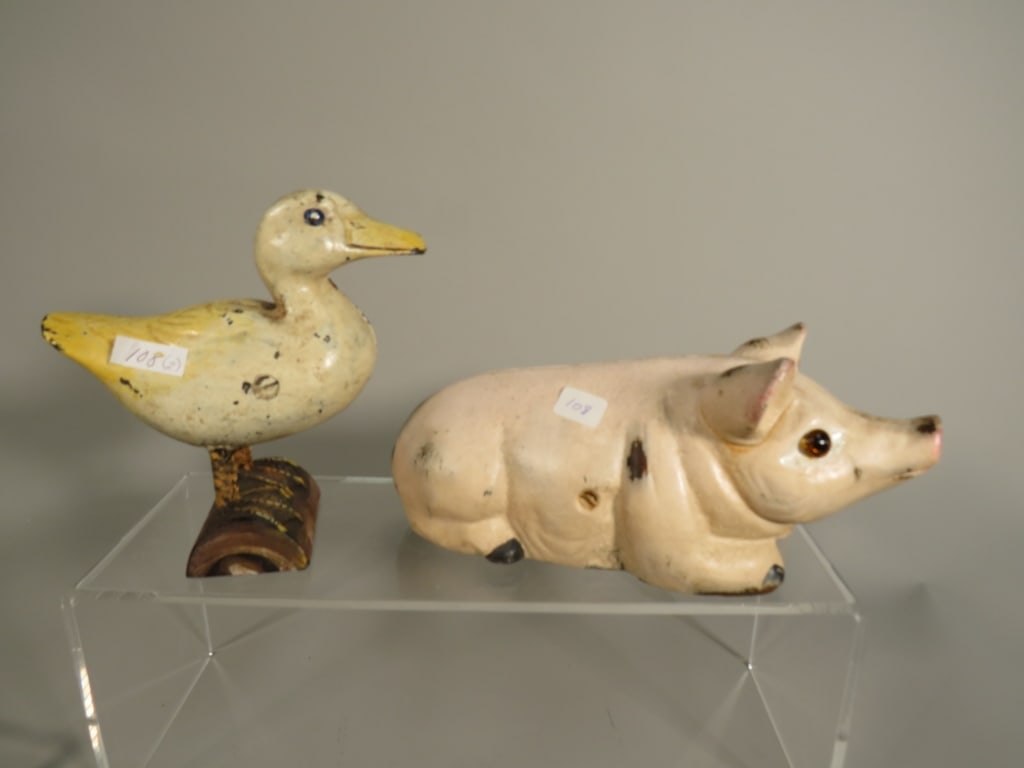 Two Cast Iron Coin Banks - Pig and Duck (1 of 5)