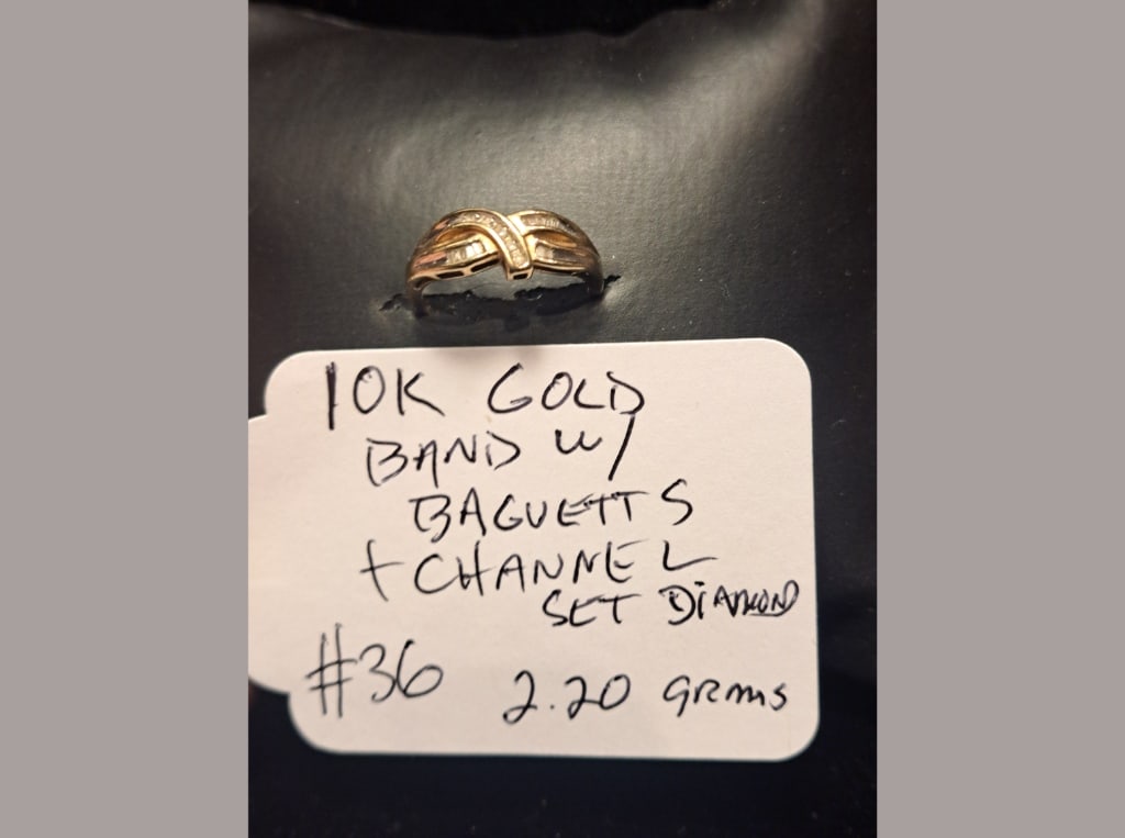 10K Gold Band w/ Baguettes: 10K gold band with baguette diamonds and channel-set stones, 2.20 grams.
