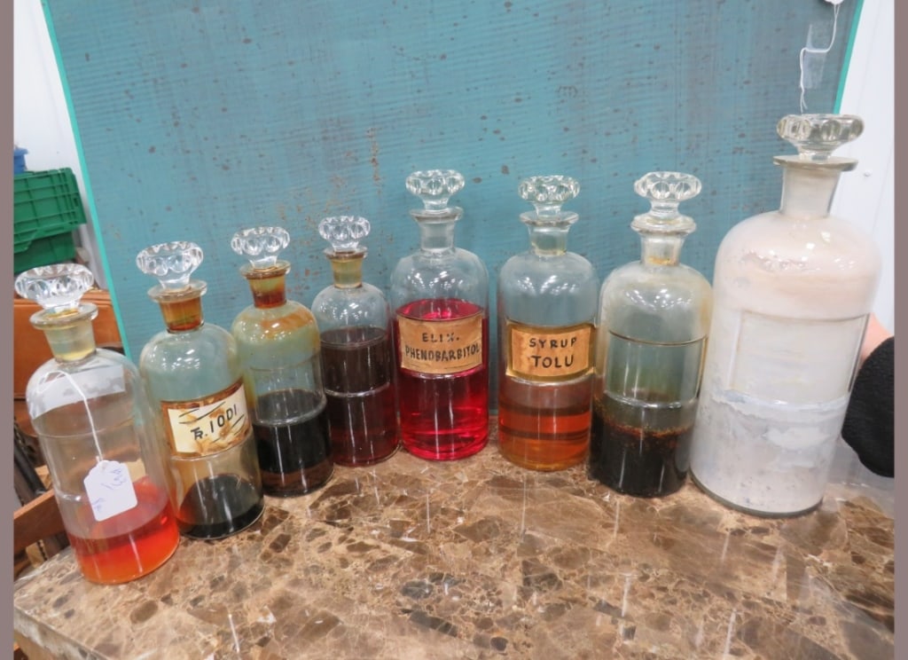 8 Apothecary Bottles: Some glass labels and contents.. 13" height