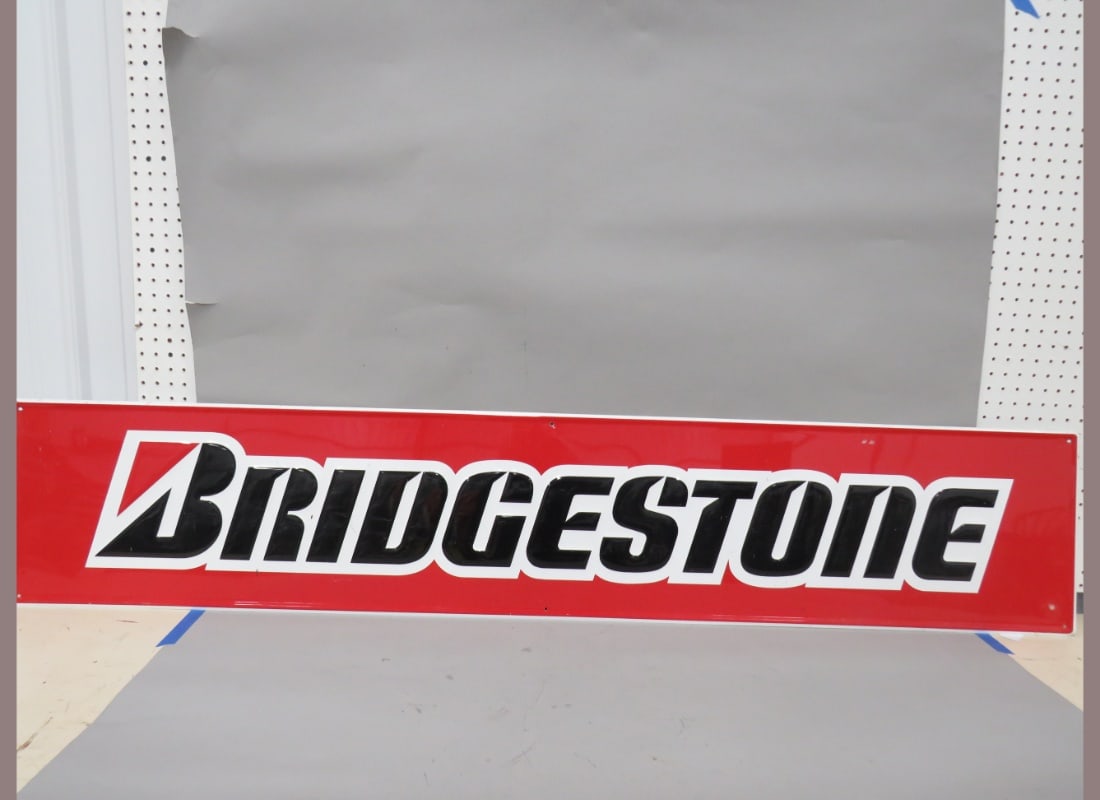 Bridgestone Metal Embossed Sign: Nice Condition. 14" x 72"