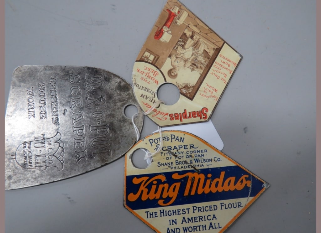 Three Advertising Pot Scrapers (1 of 5)