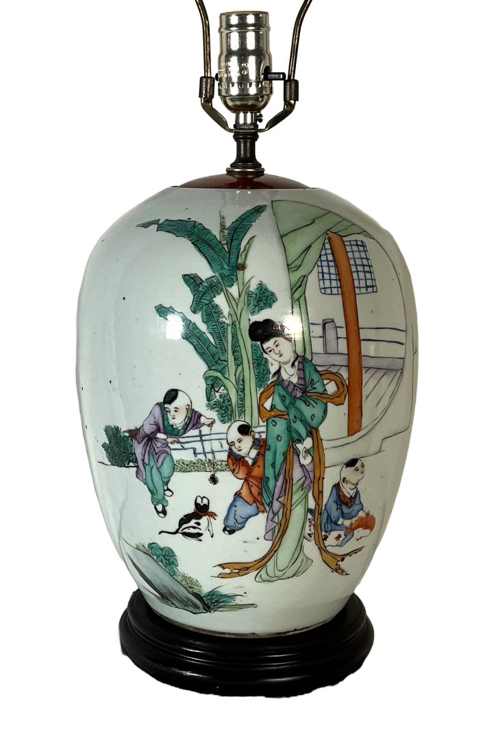 Chinese Rose Famille Lamp, c1960: Painted scene of a mother, children and pet cat in front of their porch with four sets of vertical calligraphy along the back of the lamp.17.25" to top of socket.