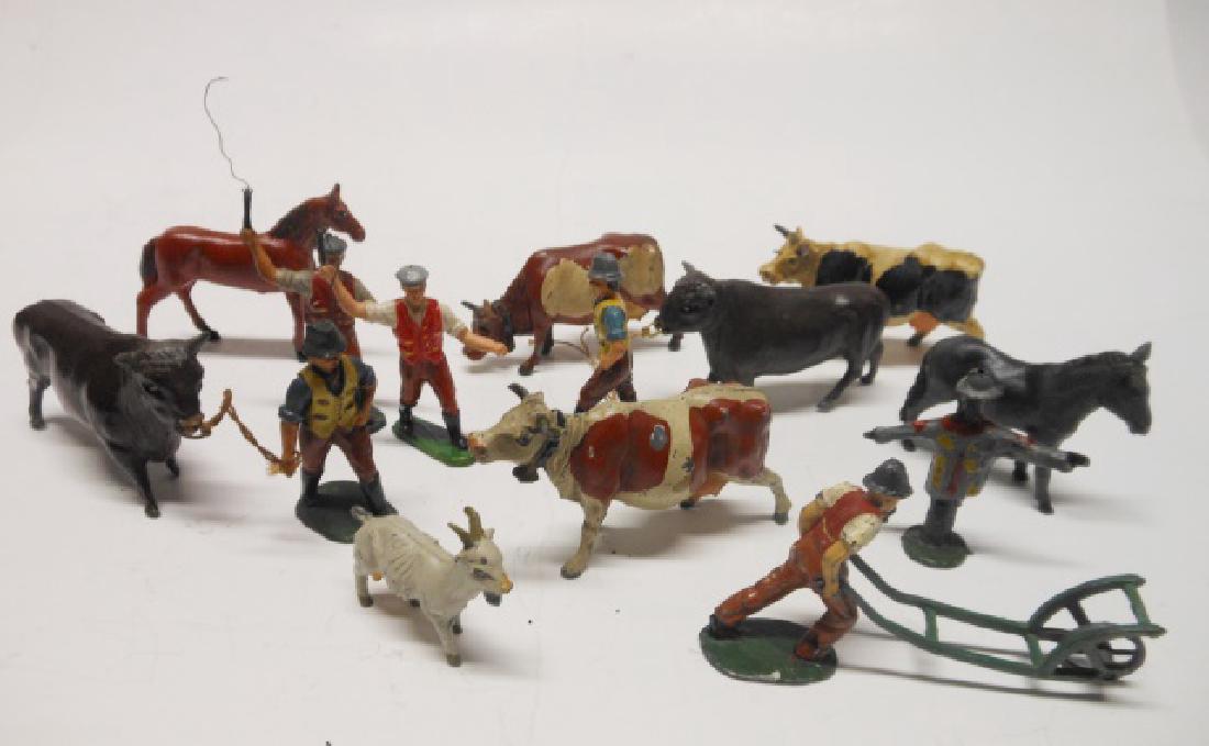 Timpo Farm Animals and People: Post War. 14 pieces. Including 2 men with bulls, man pushing long barrow, scarecrow, animals, etc. Condition very good.