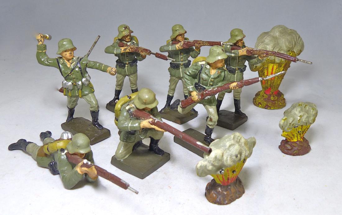 Lineol 7 German Soldiers and 3 Explosions: The 3 explosions have no cracks but general wear. The 3 standing riflemen have some cracks and wear. The 2 charging are very good. The other 2 have no cracks or apparent wear and are excellent. The so