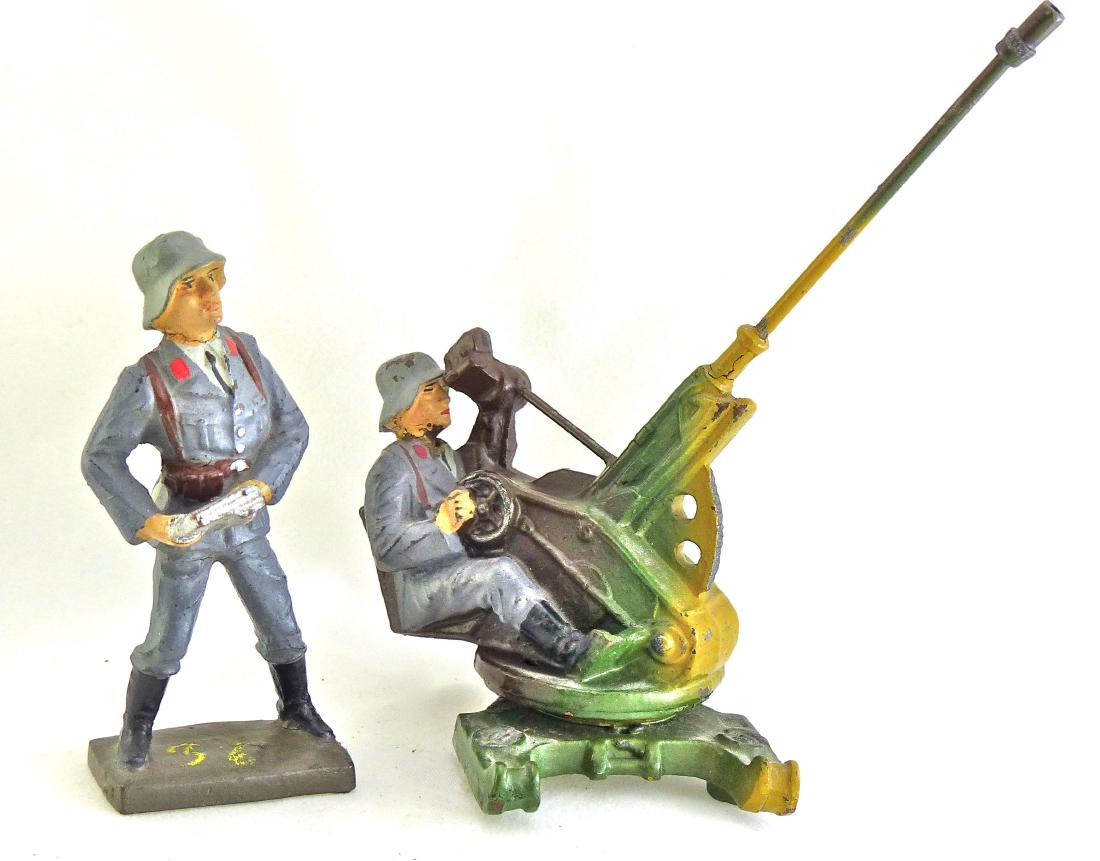 Lineol 2 cm FLAK and Soldier with Magazine: Soldier at 2 cm FLAK has no cracks with just some very light wear to man and gun. The paint is excellent and all original. The gun can be rotated on the base to take up different positions. Soldier wi
