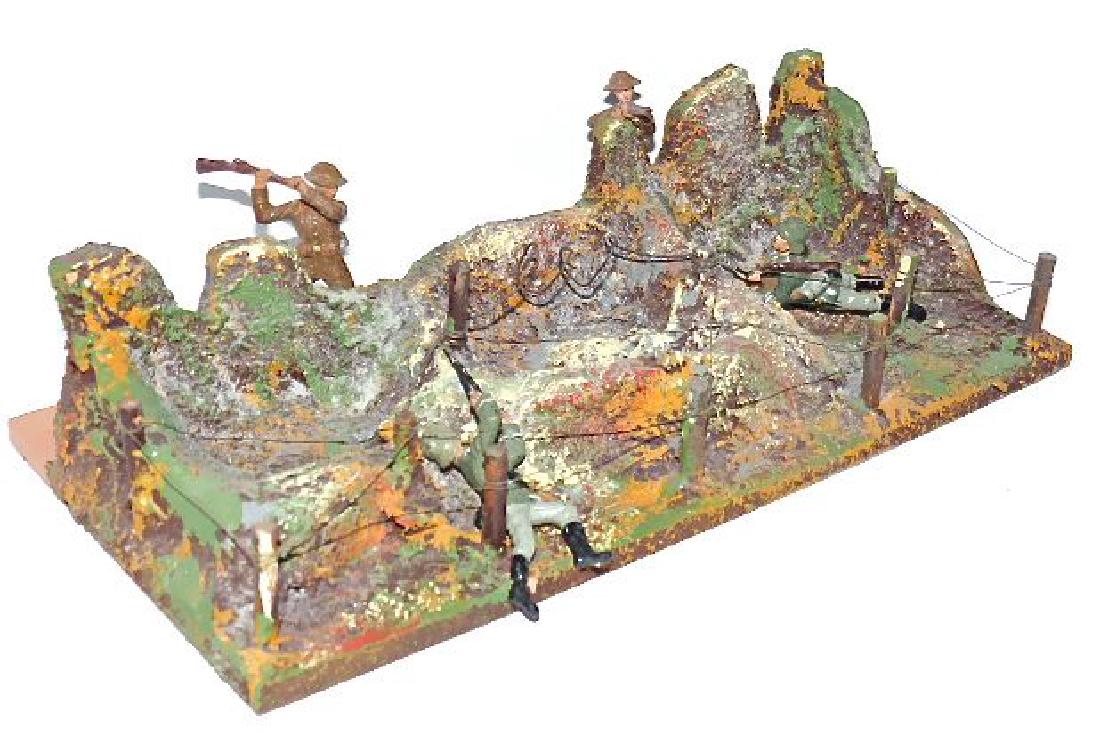 Hausser Prototype Bomb Craters Wires 4 Figures: This piece came from the Hausser Archive Sale. Late addition to their West Wall series. Base marked O. and M. Hausser with cat #13470/9. Like new. Base is 12 1/2 inches x 7 inches. Highest point about