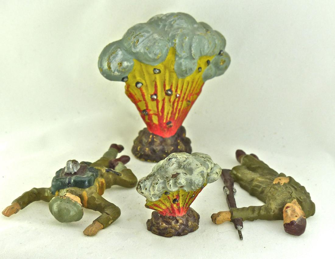 Lineol 2 Explosions 2 US wounded on Ground: Both explosions with hardly any wear and no cracks. Wounded with helmet one thin crack and hardly any wear. Wounded with rifle shows no cracks or wear. 4 Pieces. 7.5 cm. Figure with rifle made ONLY 19